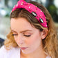 Fuchsia Stone & Gem Football Embellished Top Knot Headband